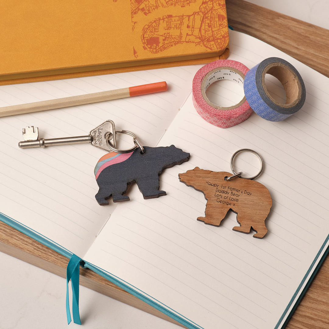 Father’s Day keyring with aurora-inspired design, shaped like a bear and shown on customisable greeting card.