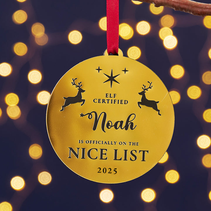 Gold personalised Nice List Christmas tree decoration with name and year.