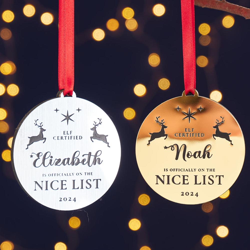 Custom engraved gold or silver Christmas decoration with name and date.