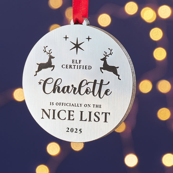 Silver metallic Nice List bauble, custom engraved Christmas ornament.
