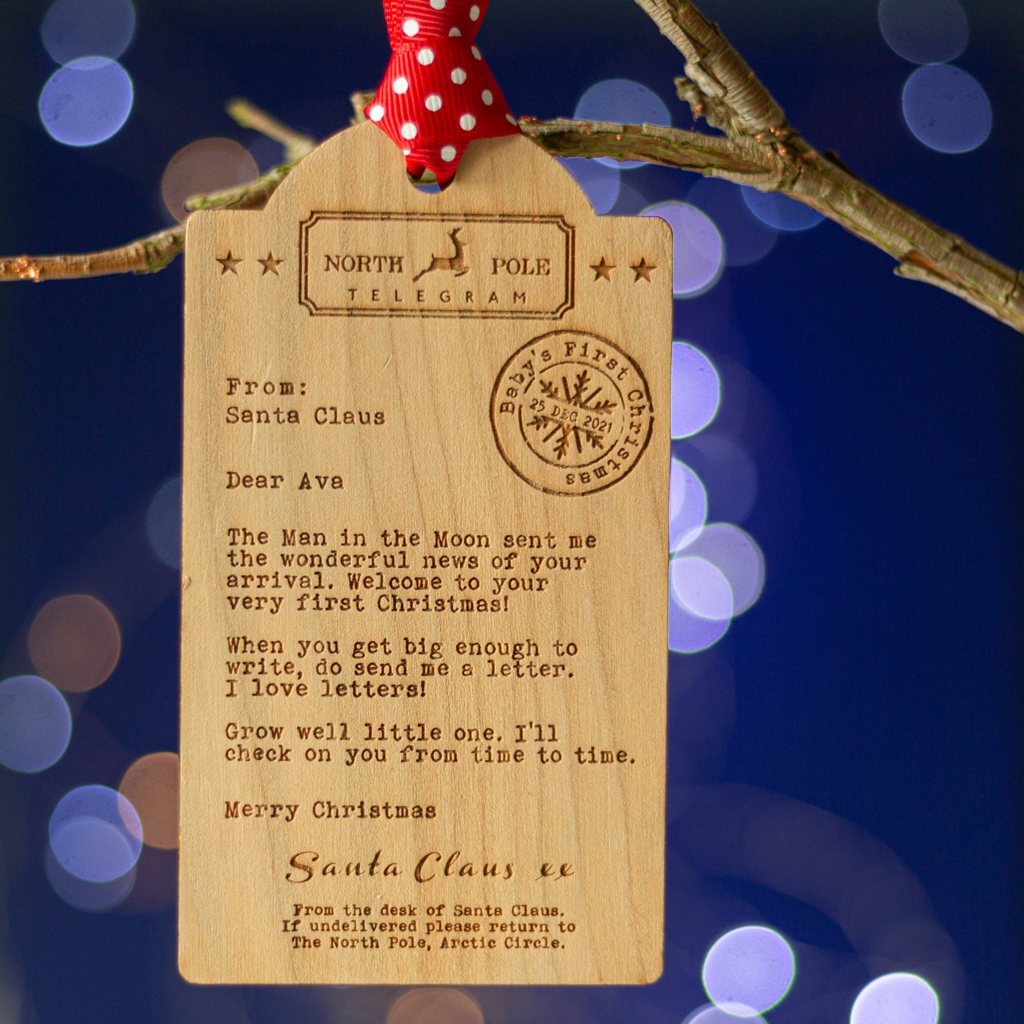 Luggage tag shaped Wooden decoration engraved with a typed message from Santa Claus