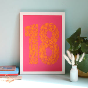 Fuchsia pink papercut with a geometric 18 highlighted in orange