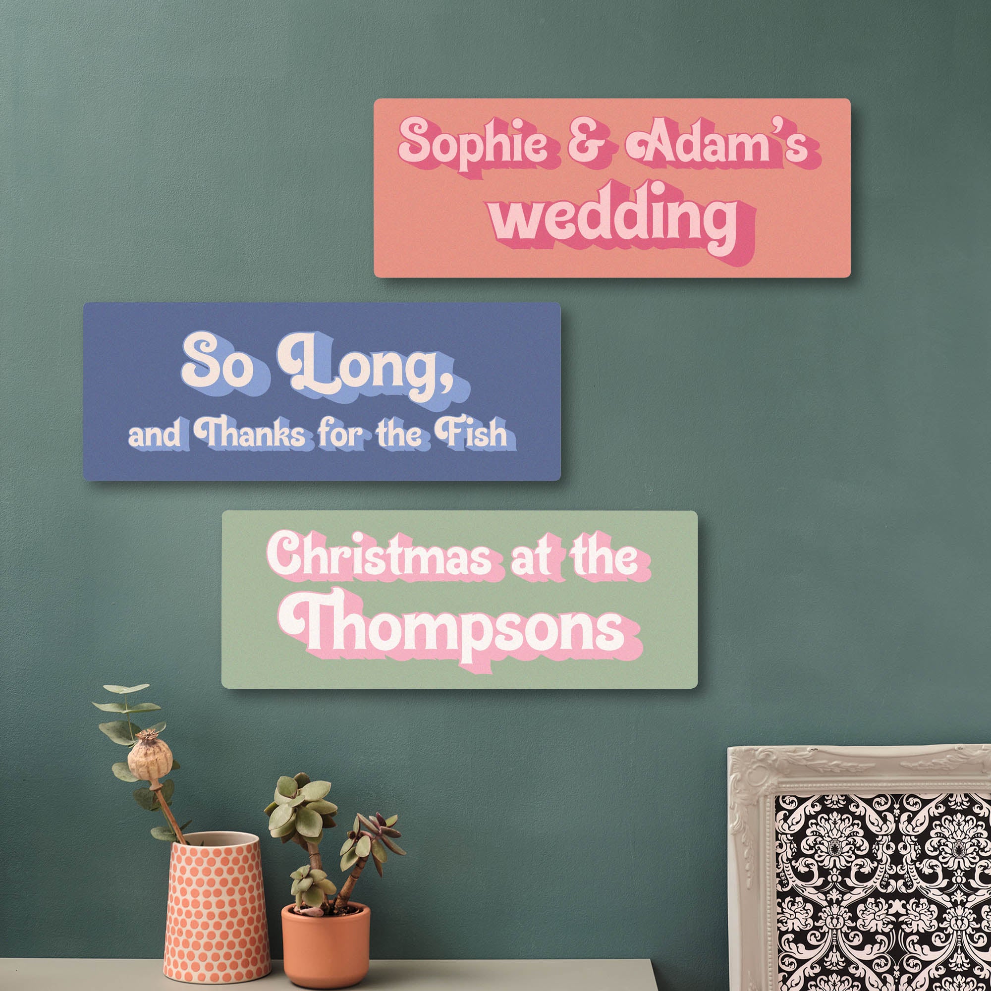 Three decorative personalised printed home decor custom signs with personalized text on a green wall. Perfect first Christmas or Wedding gift for new couples or add a favourite quote to a teenagers bedroom.