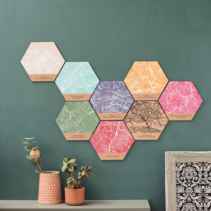 8 bespoke wall art print signs hangings of different bright coloured map locations with customisable personalised text adding a bright pop of colour to any wall.