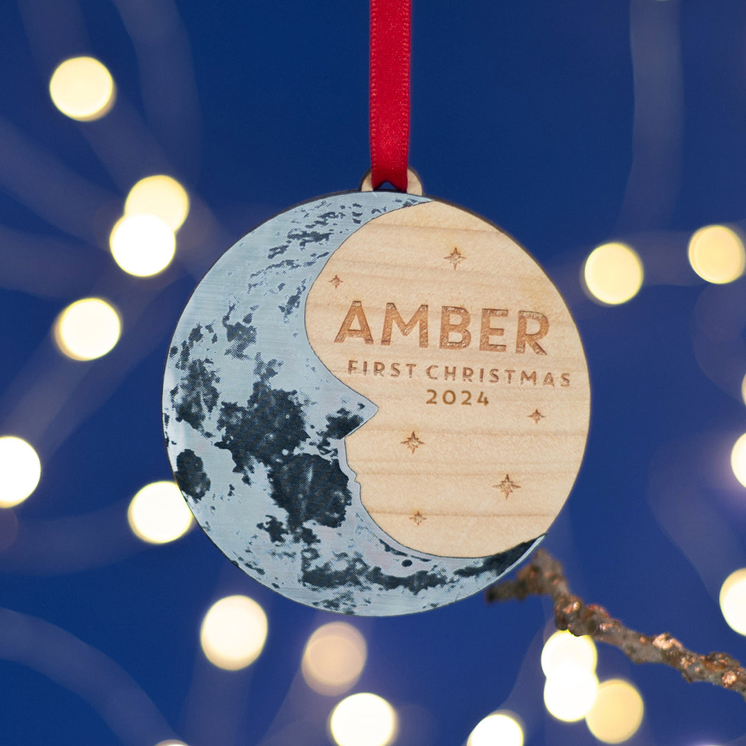 First Christmas personalised wooden ornament for newborn gift. Features a silver crescent moon and custom text.