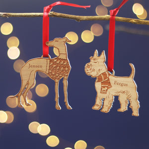 Two wooden dog Christmas tree laser-cut ornaments of a Whippet, greyhound, hound dog lovers gift. Alongside a Westie, Cairn, Scottish, Terrier, or Miniature Schnauzer, with personalized names for pet owners secret santa or stocking filler gift.