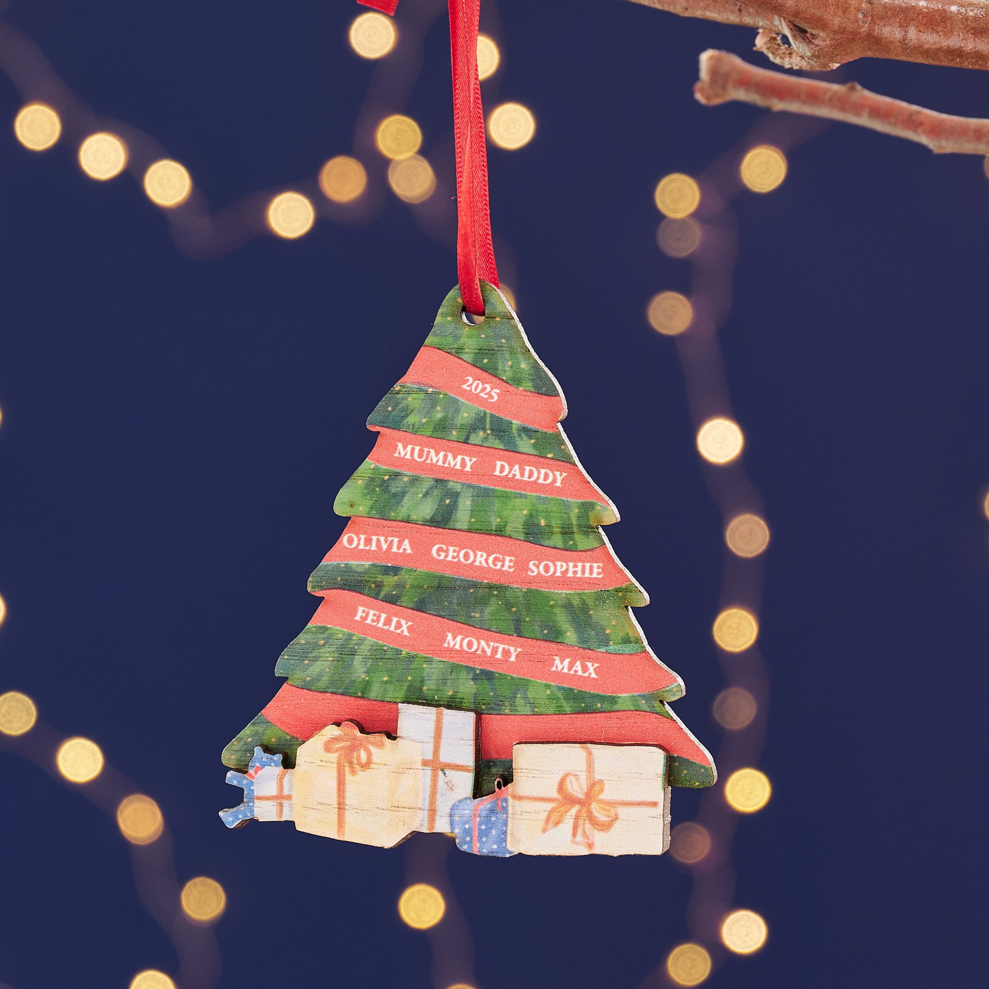 Personalised wooden Christmas tree bauble with hand-painted design and engraved family names