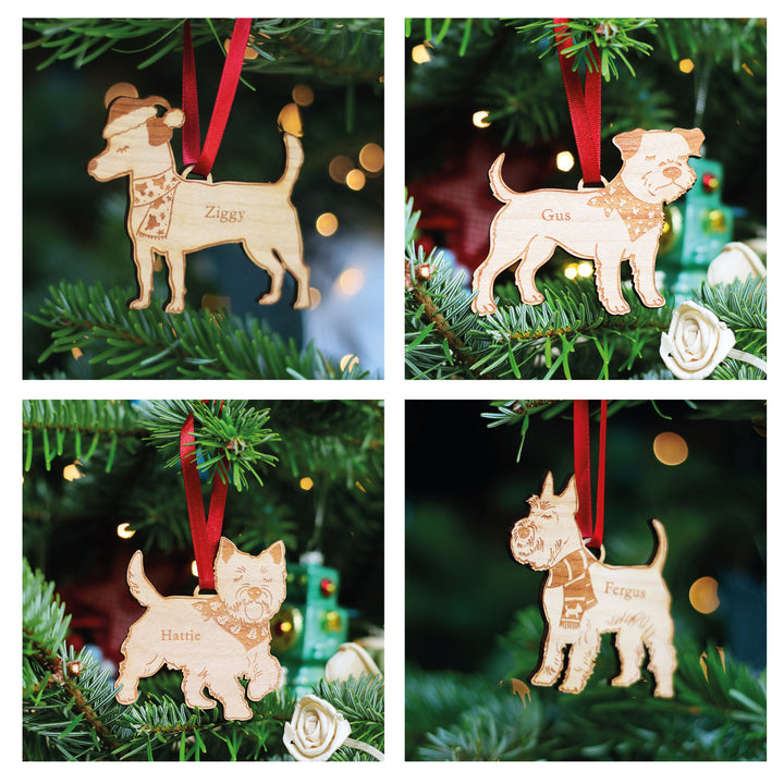 Four dog-shaped wooden Christmas tree ornaments hanging on a tree with personalised names engraved. Many dog breed gift options available, for your Dog Walker, Pet Sitter, Small or Big Dog lover.