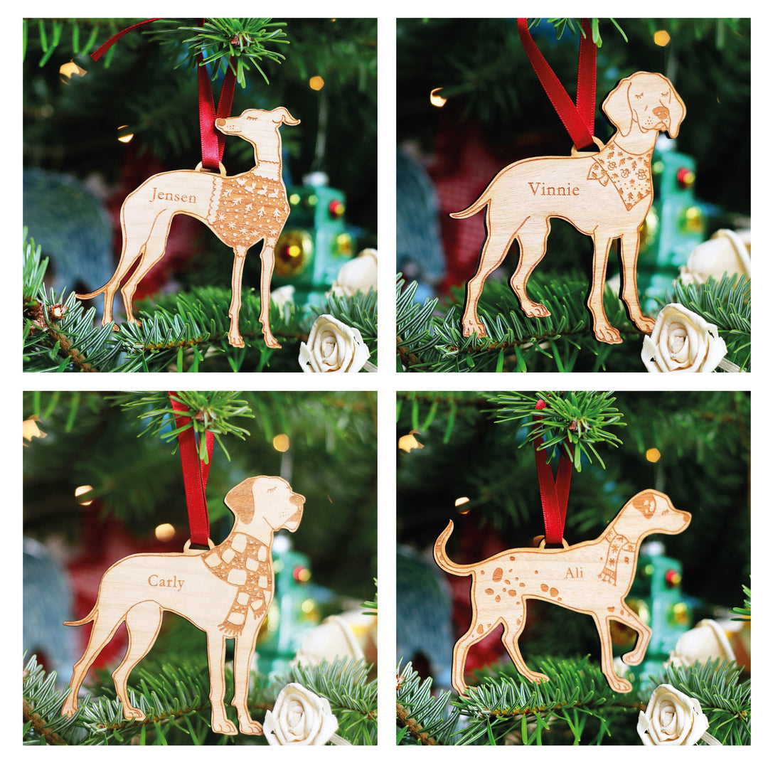 Whippet, Hound, Greyhound, Great Dane, Shepherd, Doberman, Dalmatian, wooden Christmas bauble for Christmas tree gift. Strung each with a red ribbon hung on a real Christmas tree. Each festive decoration has space for a personalised pet name to be engraved making for a perfect pet lovers or secret Santa gift. 