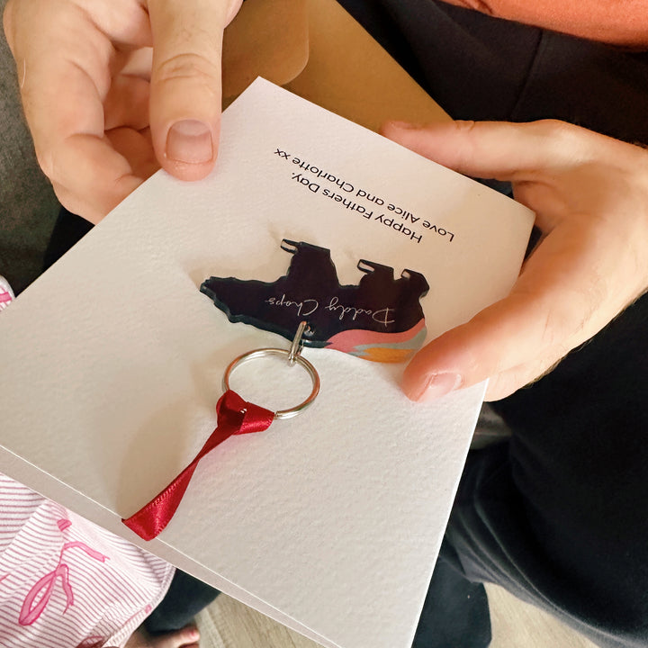 Dad holding a thoughtful first Father’s Day gift – aurora bear keyring with personalised card, perfect for new dads.