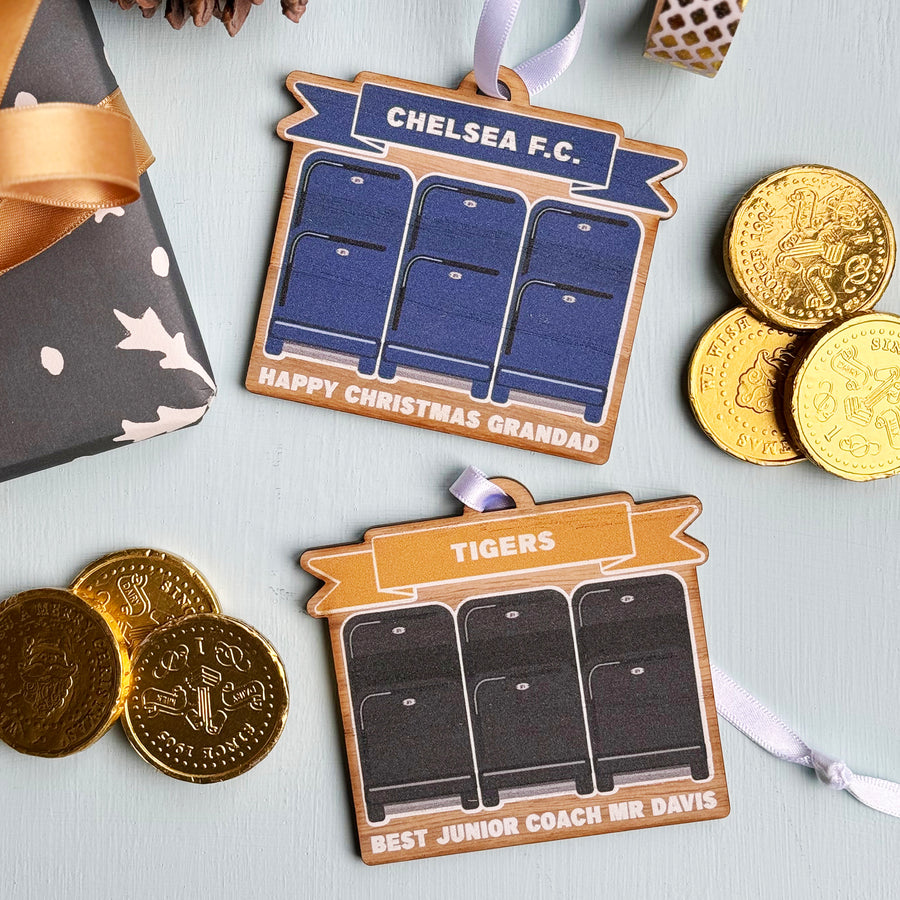 Sports-themed Christmas decoration with rugby or football stadium seating, gifts for the coach or fans.