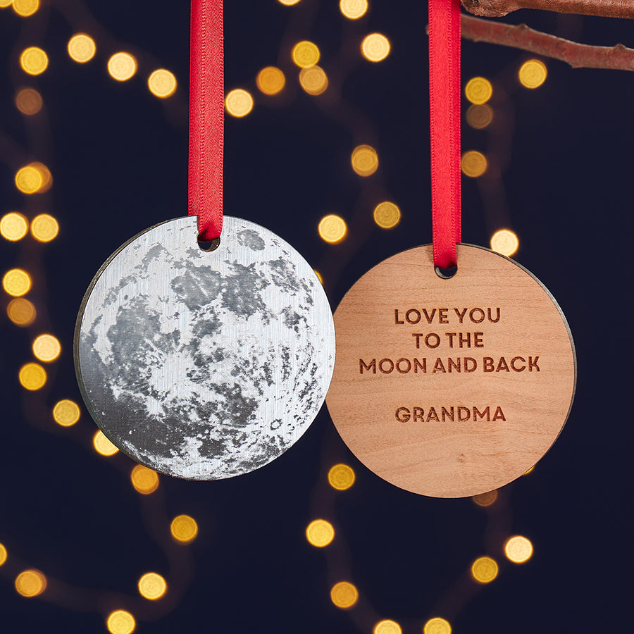 Silver personalised moon Christmas bauble with engraved wooden reverse.
