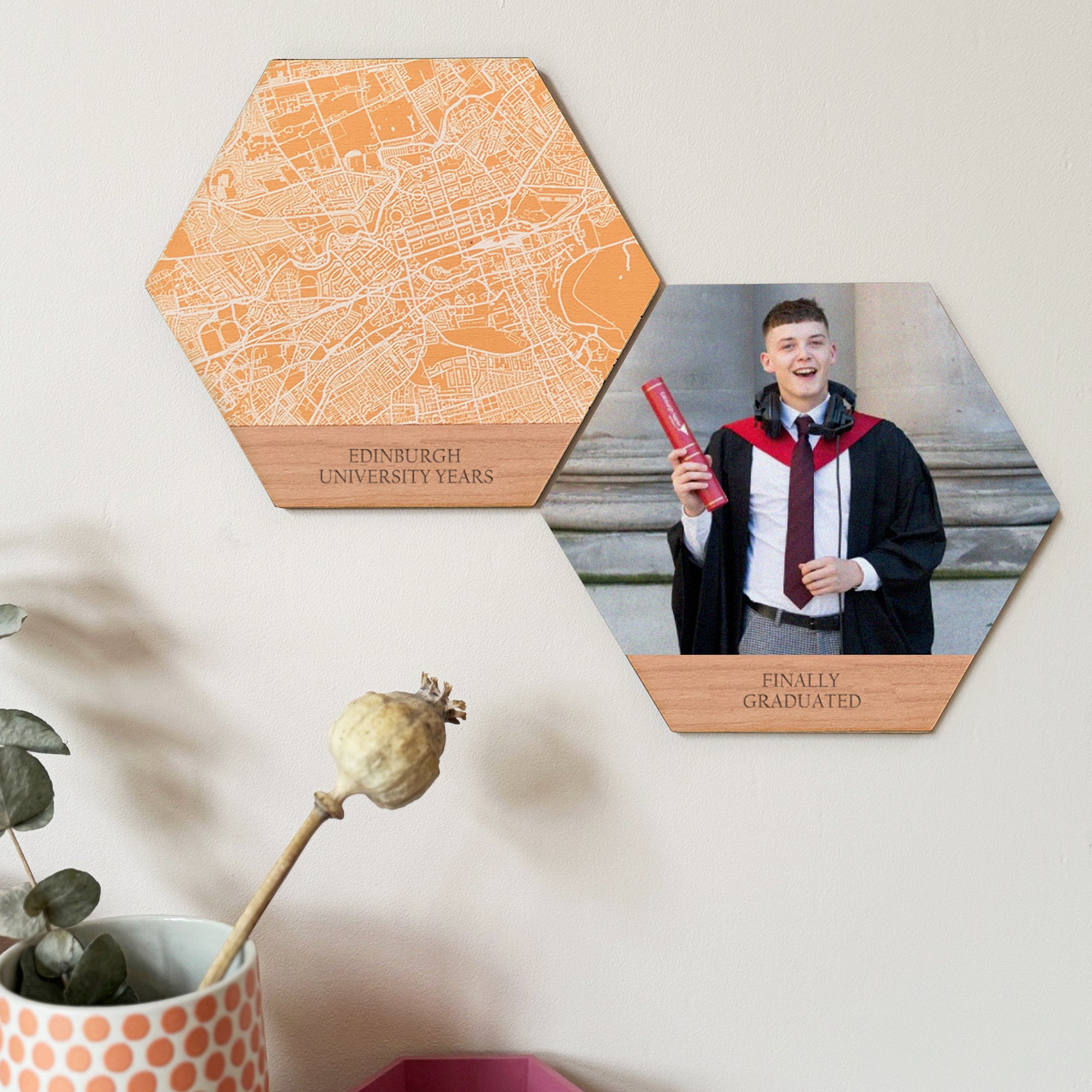 Two hexagons create the perfect graduation keepsake. One shows a young man in gown, holding his degree scroll. One shows a map of Edinburgh University. Displayed on a pale wall.