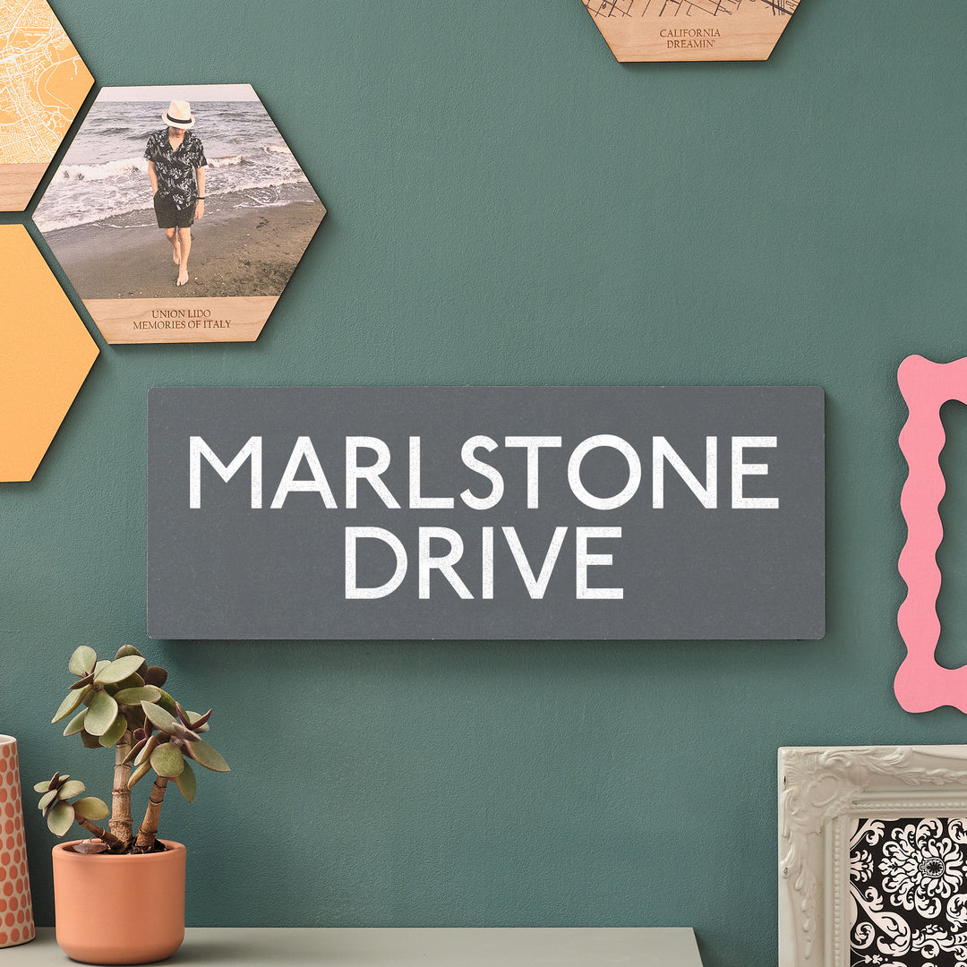 Wooden wall-mounted sign that says "Marlstone Drive," serving as a directional marker for visitors or a way to commemorate a favourite location. Perfect birthday gift for newlyweds on a honeymoon, or for new homeowners to remember previous or current special destinations.