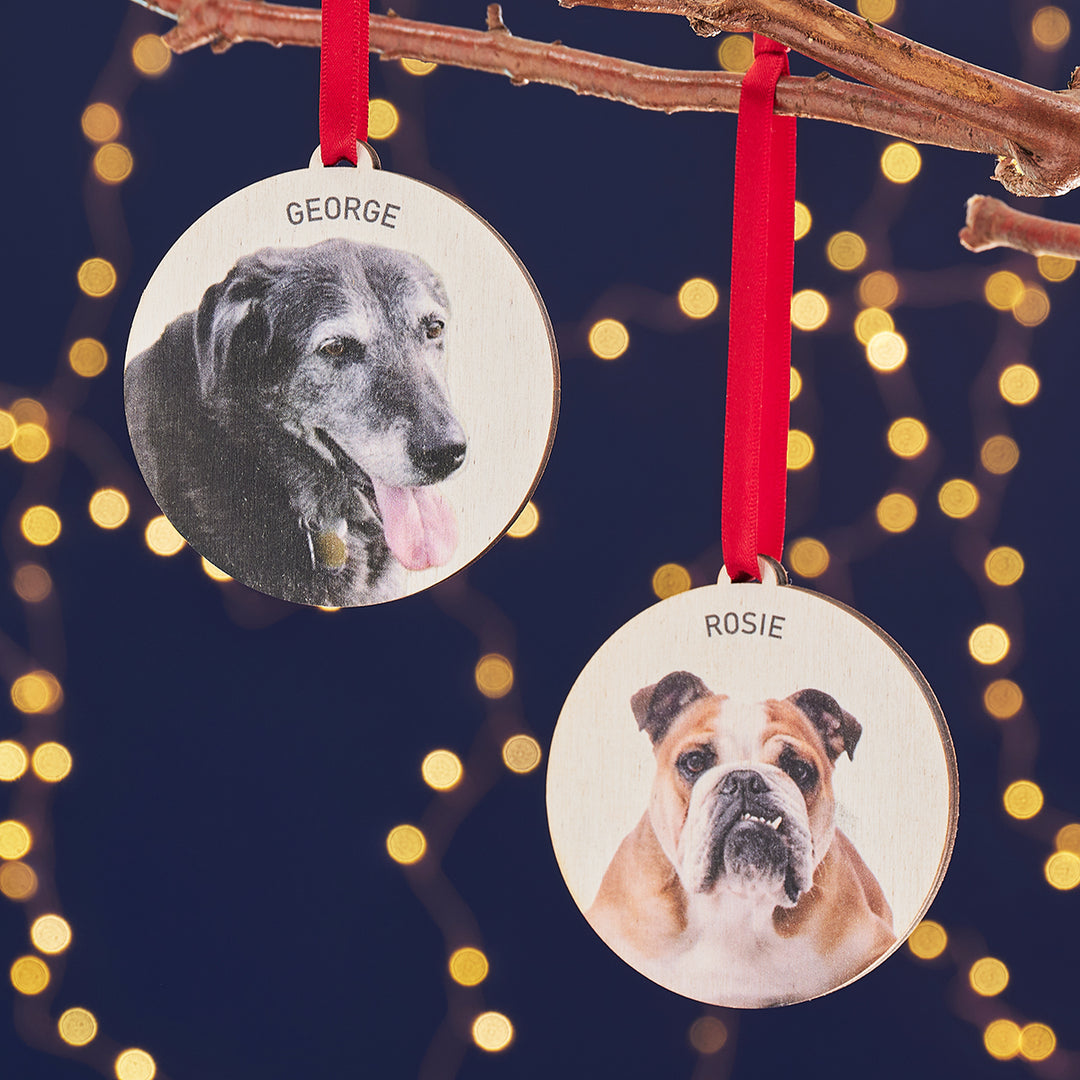 Set of two personalised dog Christmas baubles with engraved names