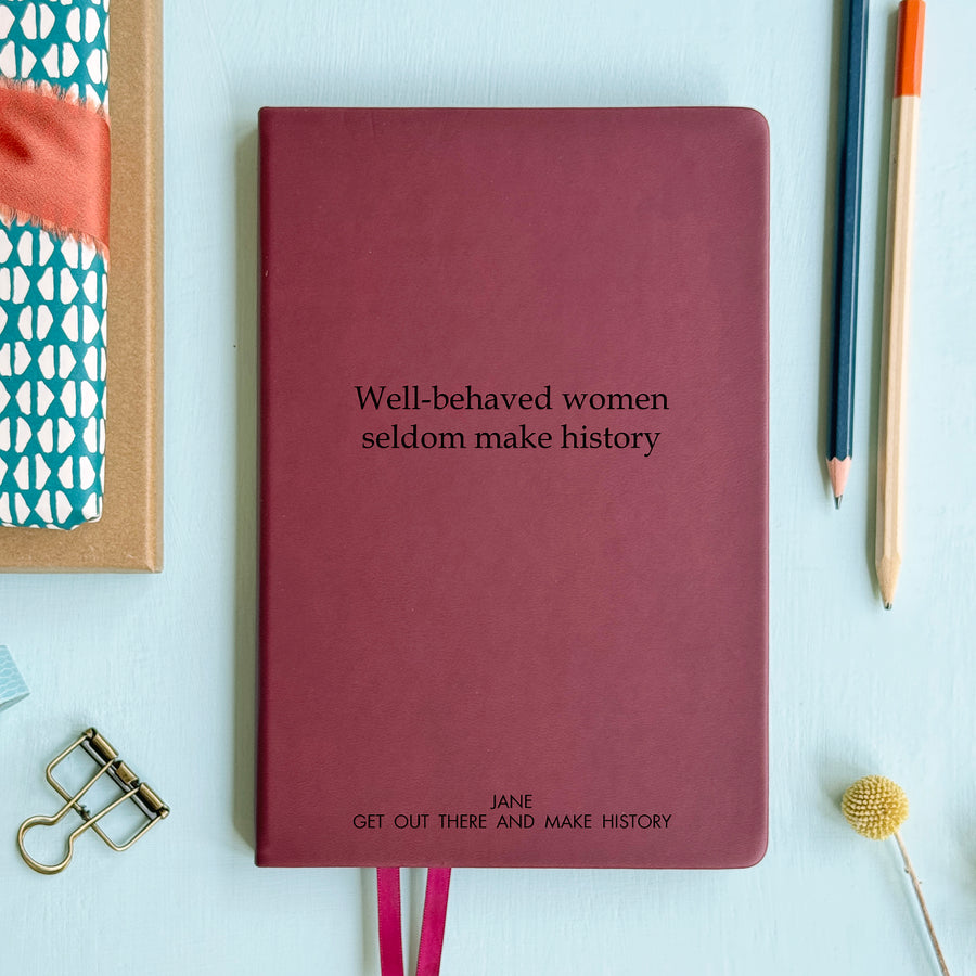 Personalised burgundy vegan leather notebook engraved with “Well-Behaved Women Seldom Make History” quote and some custom text , perfect feminist gift for women