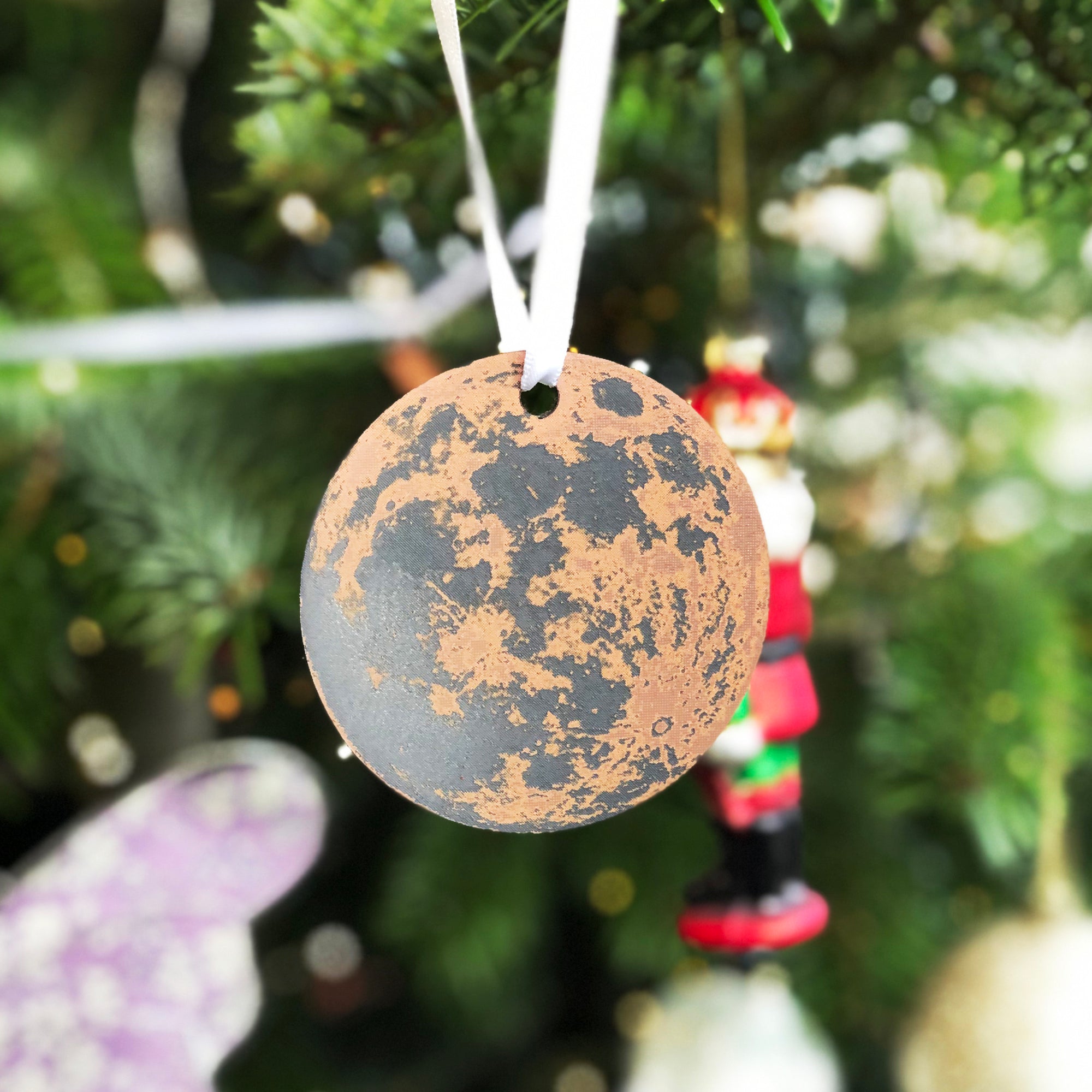 Bronze moon Christmas decoration with sustainable cherry wood back.