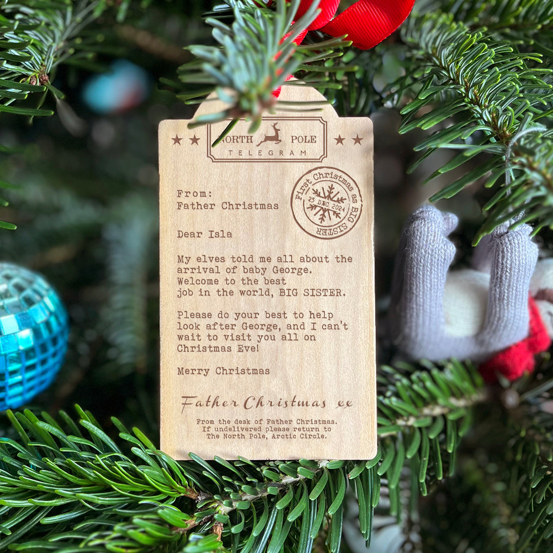 Big brother or big sister wooden Christmas tree decoration with engraved festive message.