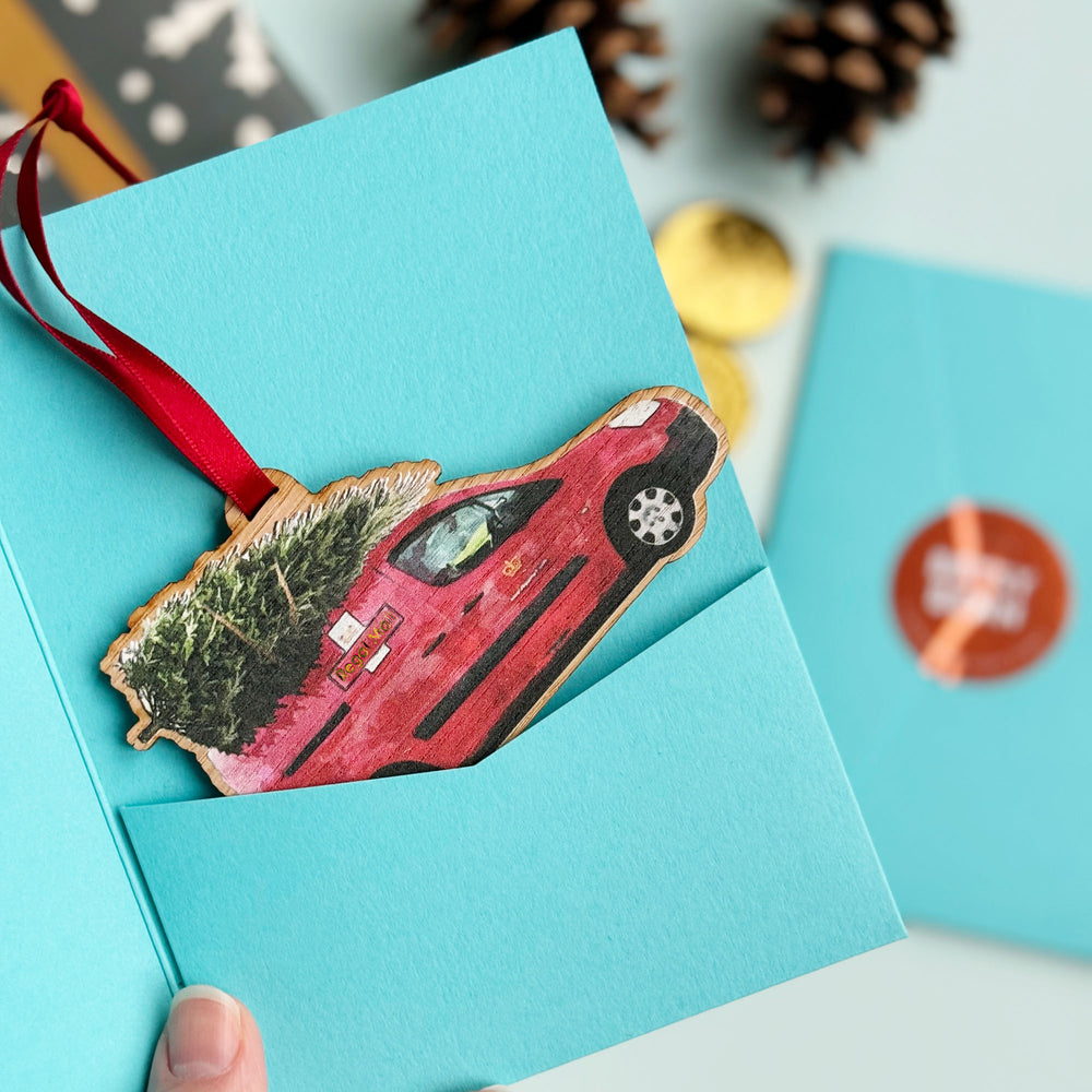 Postman Postwoman Postal worker Christmas tree bauble gift in a blue presentation gift packaging sleeve.