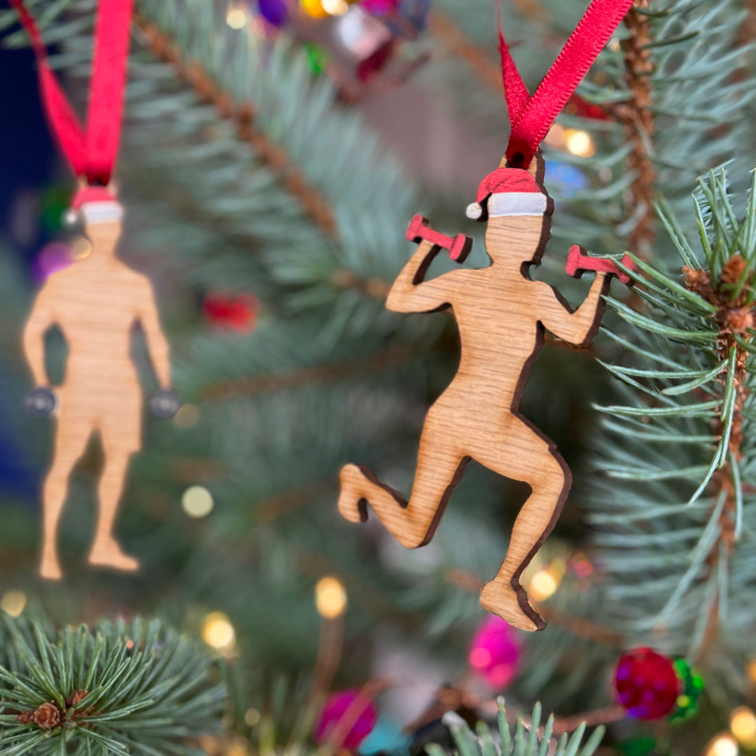 Weight lifting aerobics wooden customisable Christmas tree bauble gift for sports fans hung on a Christmas tree.