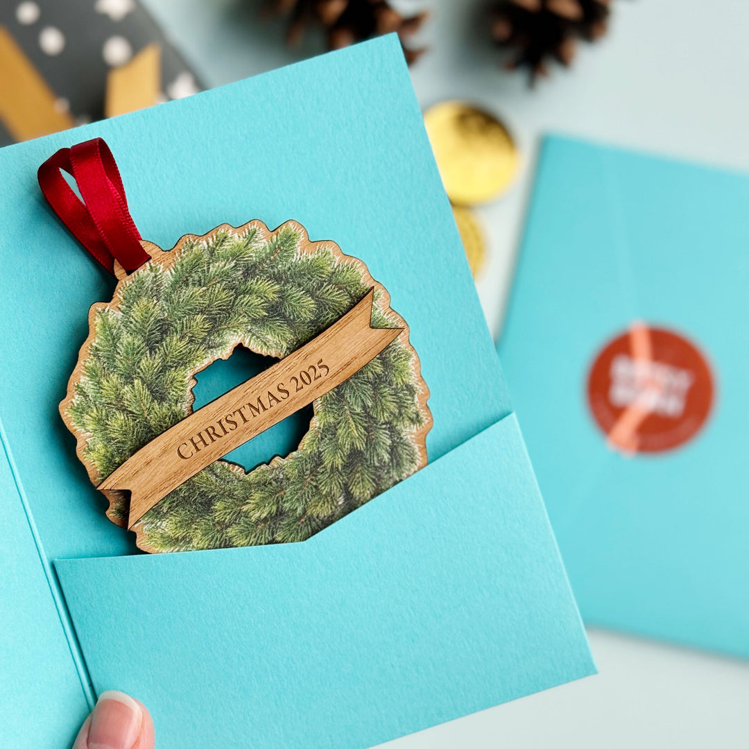 Oak veneer Christmas ornament with printed fir wreath, customised with names or message.