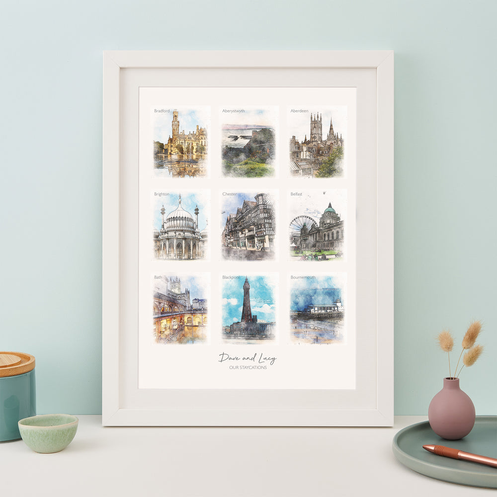 A framed print with nine watercolor paintings of famous landmarks: Edinburgh, York, Chester, Bath, Brighton, Blackpool, Liverpool, Manchester, and Newcastle. The text "Dawn and Lucy" and the year "2019" are written below the images.