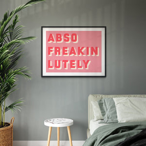  framed typographic print saying Abso Freakin Lutely on a pink background