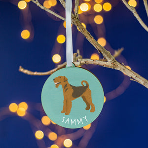 Aqua round tree decoration with a painting of an airedale terrier on the front