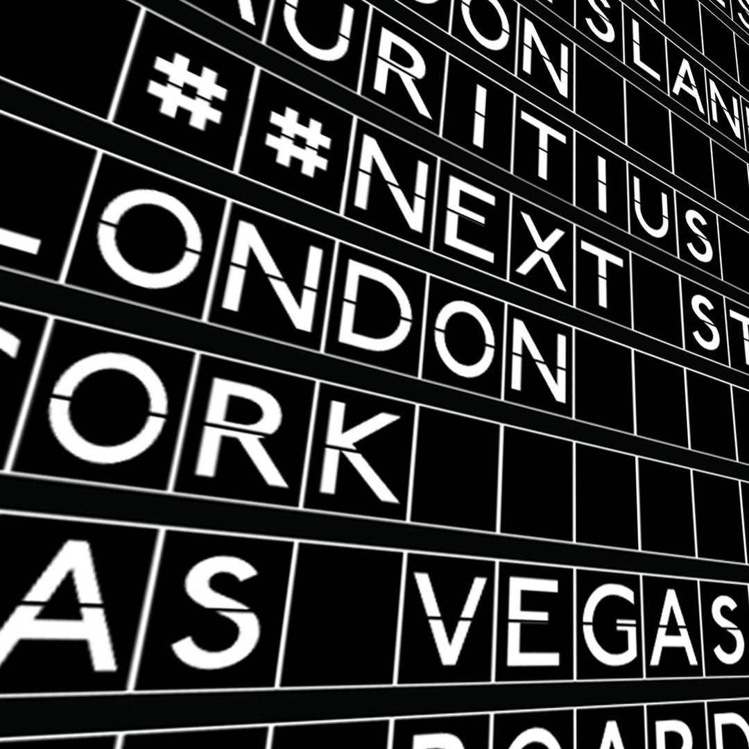 close up of black and white print in the style of an airport departures board