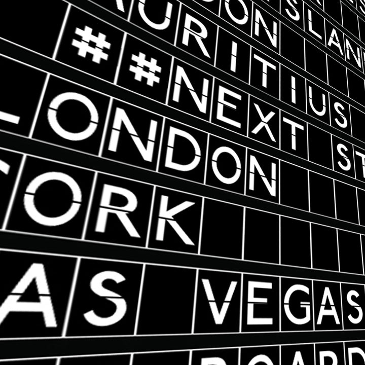 close up of black and white print in the style of an airport departures board