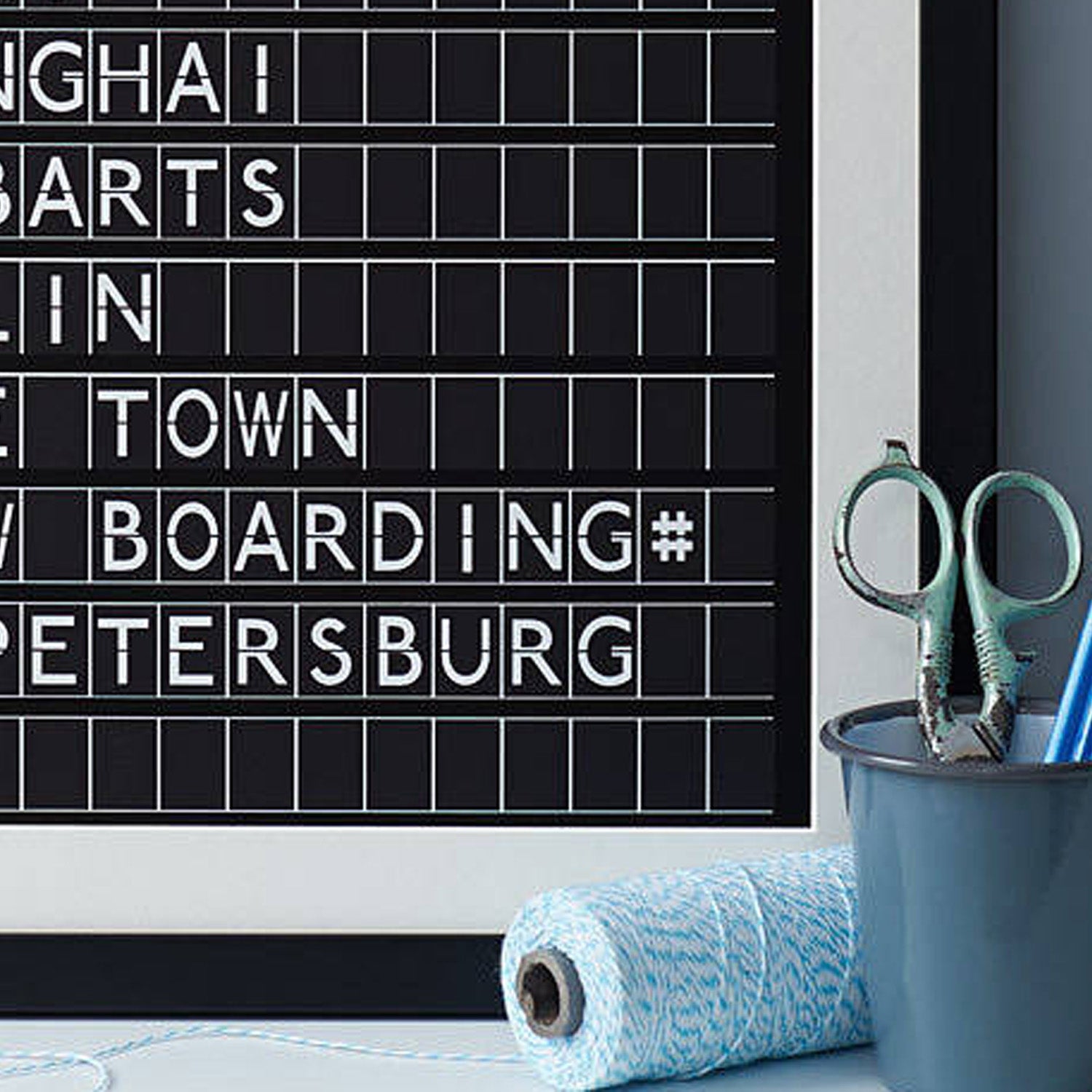 close up of black and white print in the style of an airport departures board