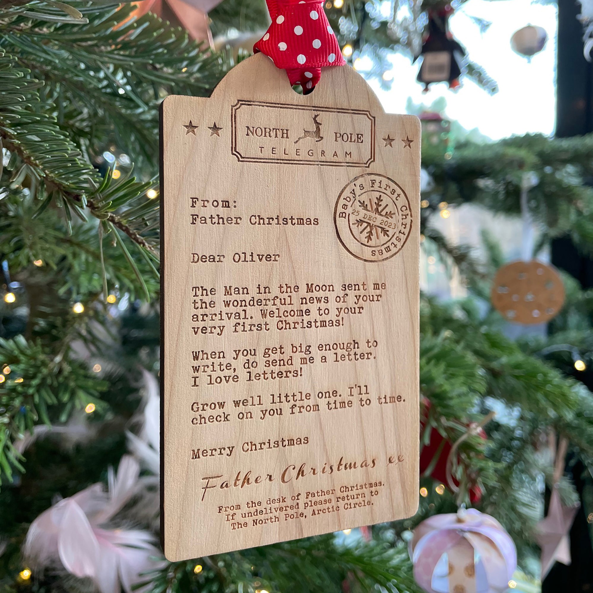Luggage tag shaped Wooden decoration engraved with a typed message from Father Christmas 