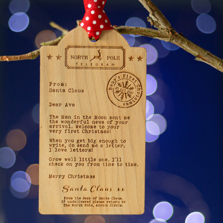 Luggage tag shaped Wooden decoration engraved with a typed message from Santa Claus