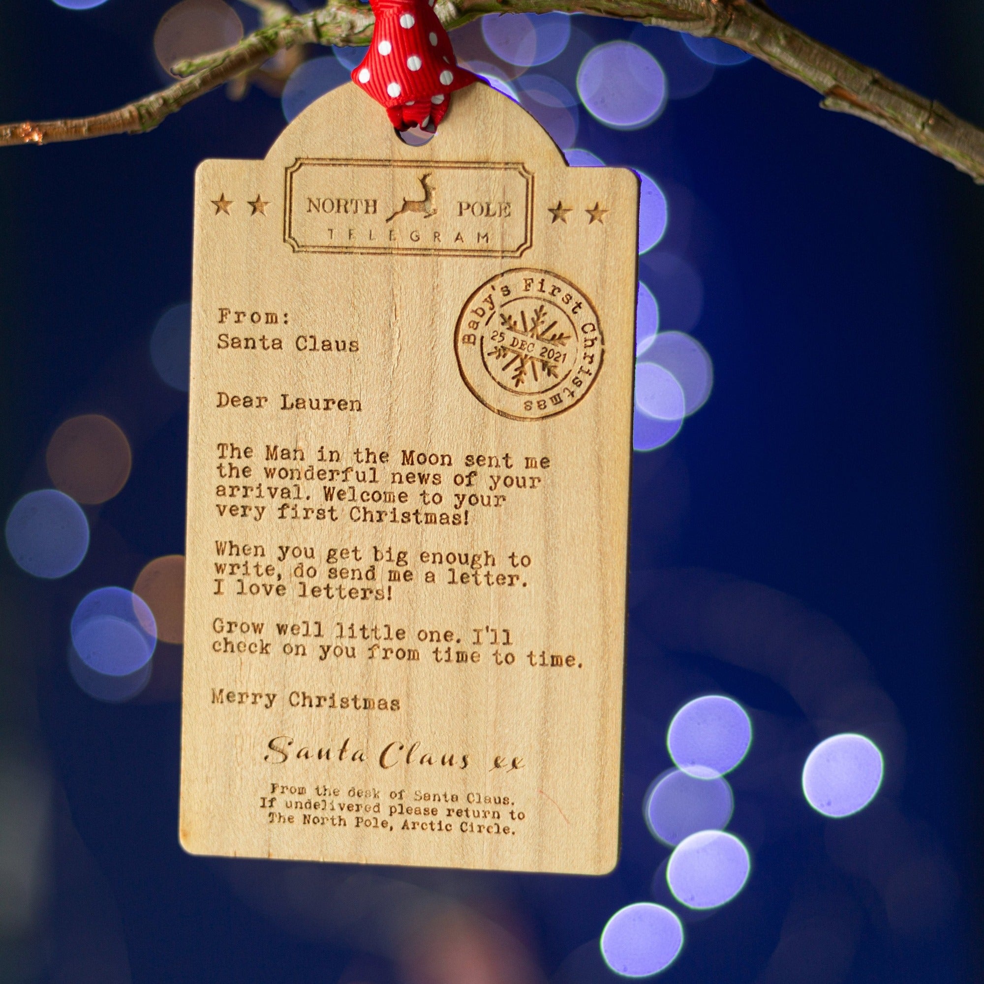 Luggage tag shaped Wooden decoration engraved with a typed message from Father Christmas 