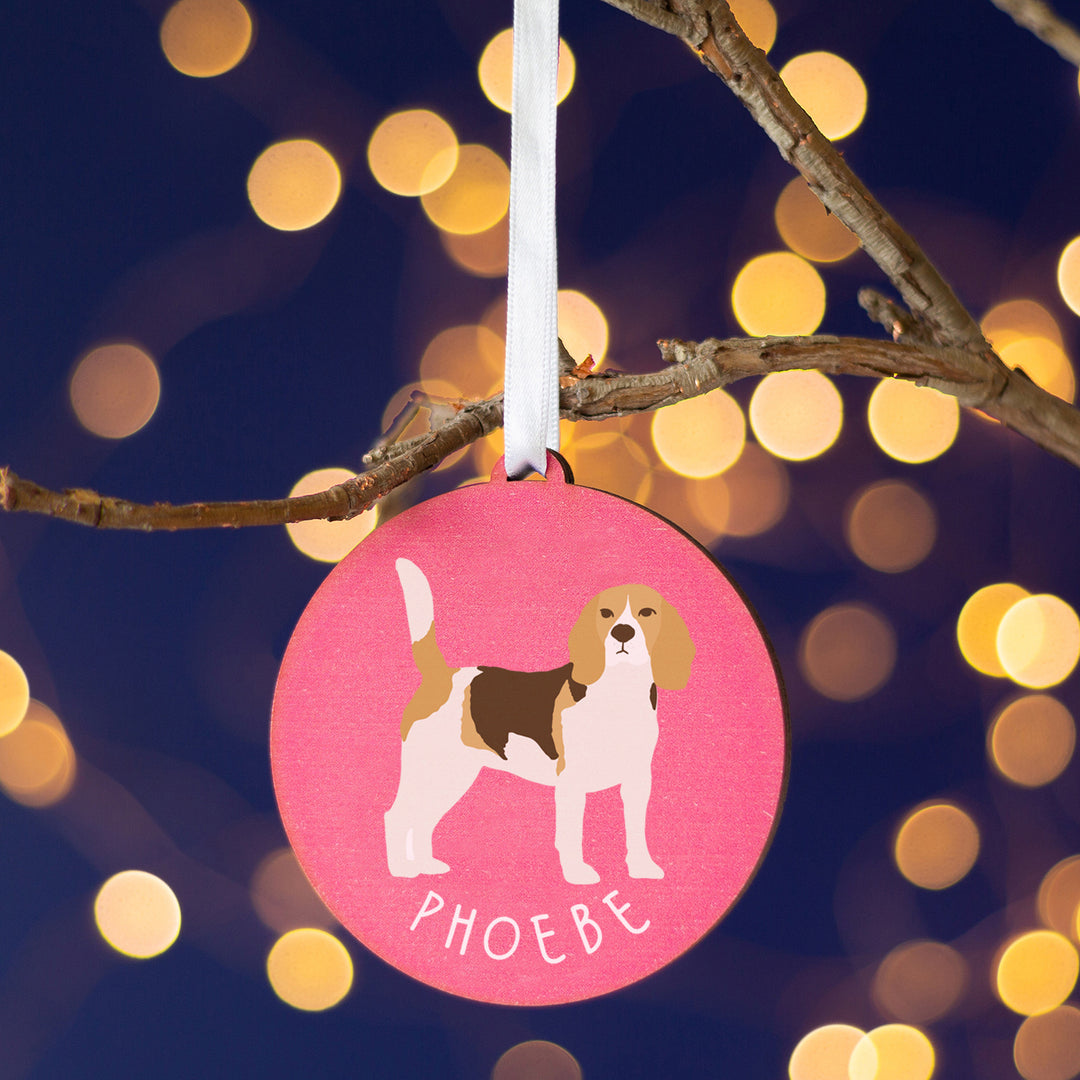 Painted wooden decoration of a beagle dog on a coloured background