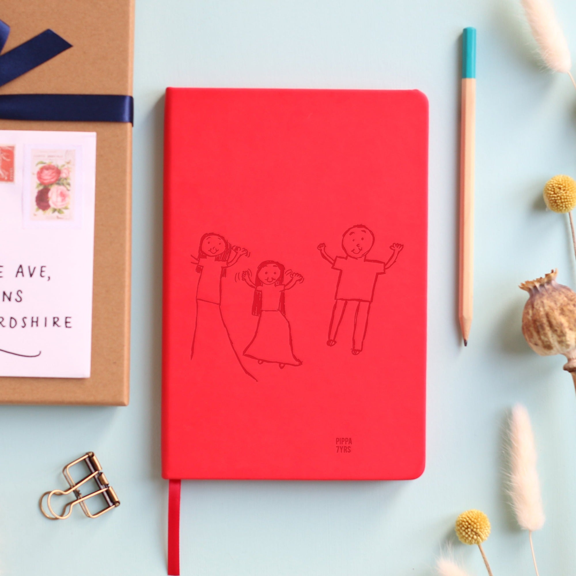 Vegan leather notebook with a personalised  child's drawing laser engraving on the cover