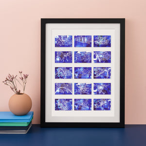 Black framed print with 15 small blue maps of different locations