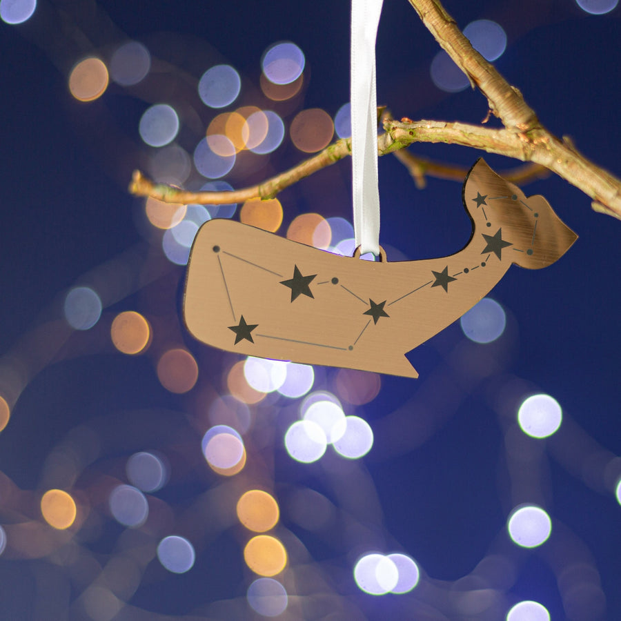Copper metallic christmas tree decoration of a whale engraved with a constellation of stars