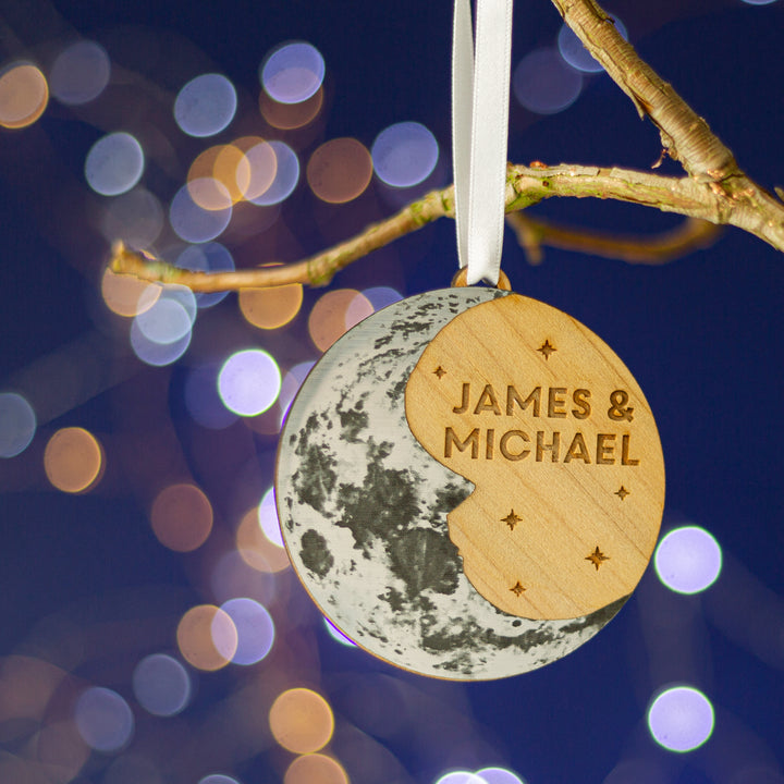 Metallic moon and cedar wood Christmas bauble, engraved with couple’s names.