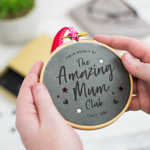 Small embroidery hoop with brightly coloured velvet inside engraved with the words "Proud member of the Amazing Mum Club"