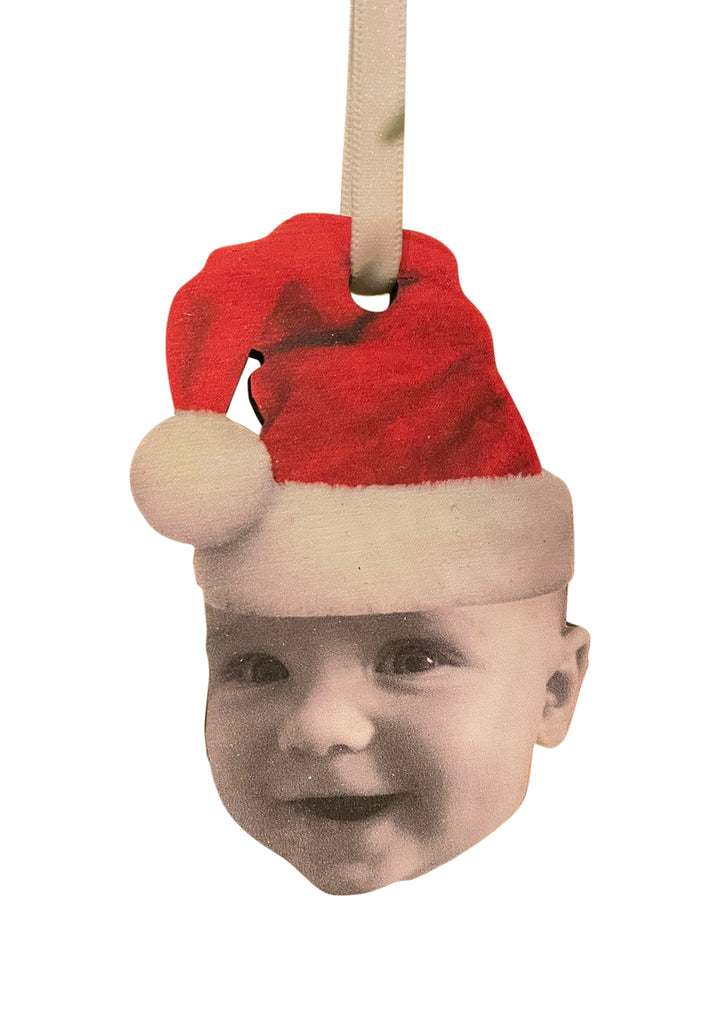 Personalised wooden Christmas bauble with a baby wearing a Santa hat.