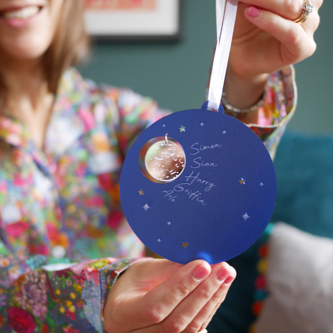 Blue and silver personalised bauble with starry night sky design.