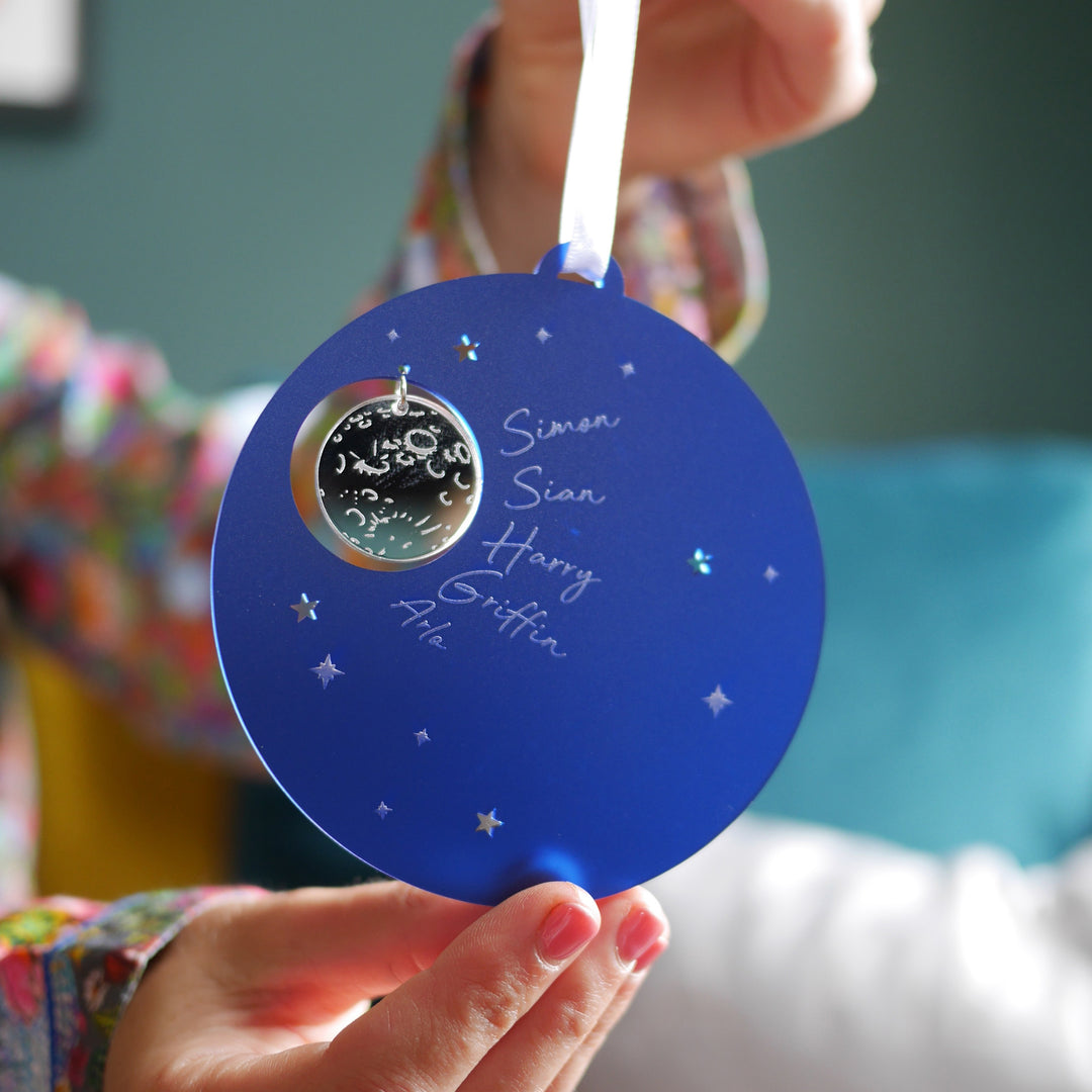 Unique night sky Christmas tree decoration with reflective silver moon.