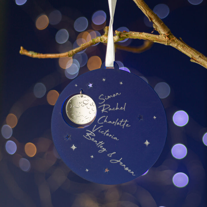 Personalised night sky Christmas bauble with silver moon and family names.