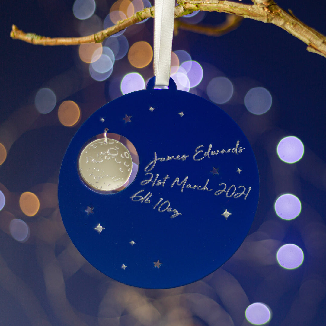 Custom engraved night sky Christmas ornament with family names.