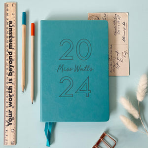 Turquoise vegan leather notebook engraved  with the year and a name