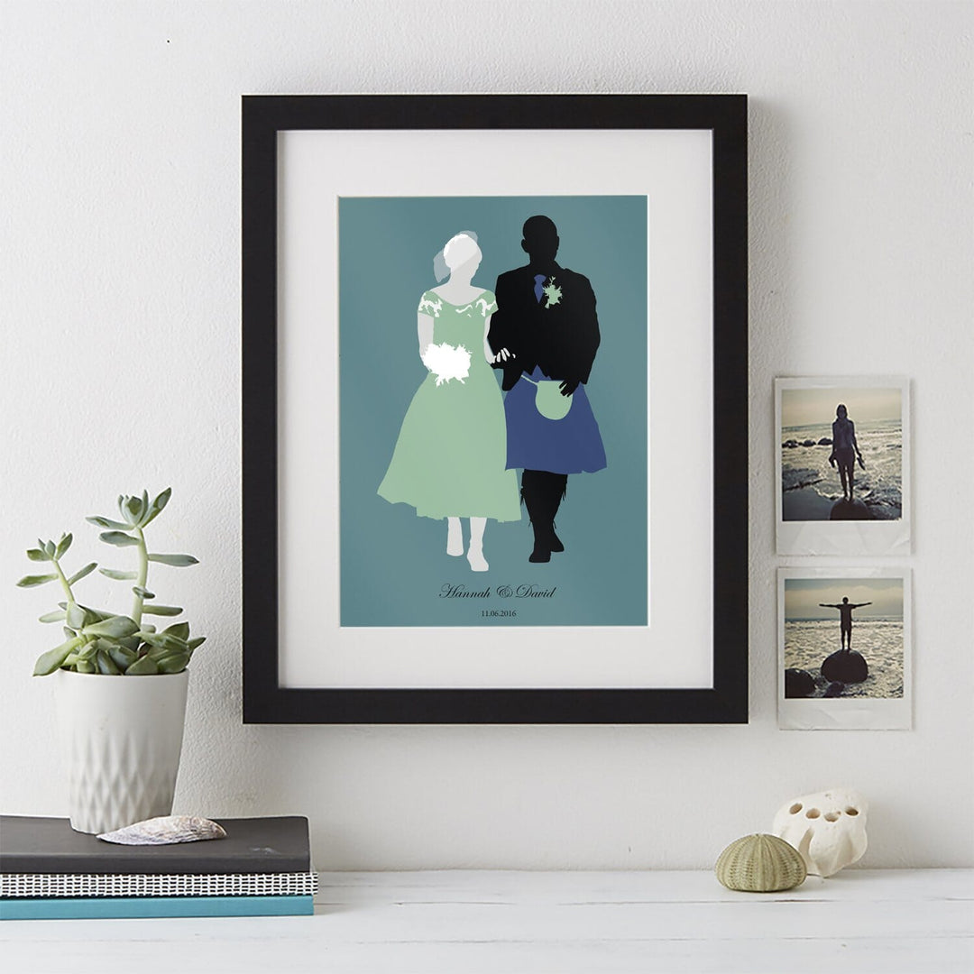 A wedding silhouette portrait in a black frame. The bride and groom are walking hand in hand on a green background. Their names and wedding date are written at the top.