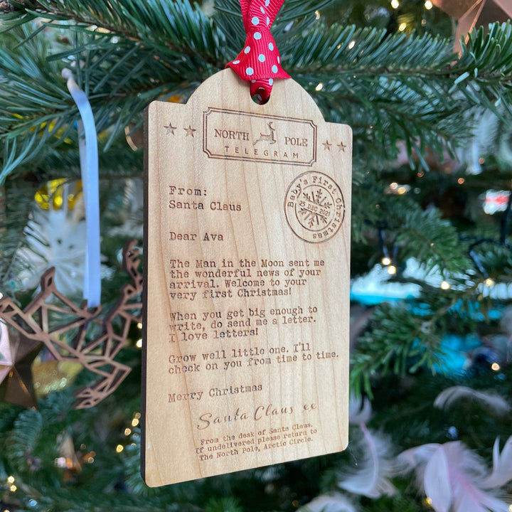 Luggage tag shaped Wooden decoration engraved with a typed message from Santa Claus