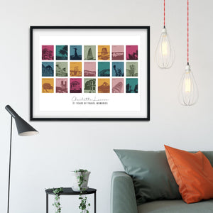 Large black framed print of 21 coloured designs showing different locations around the world in the Autumn colourway