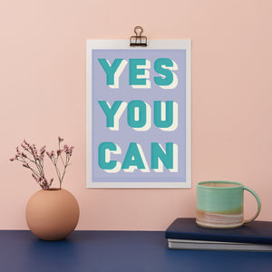 Colourful typographic print saying “Yes You Can” 